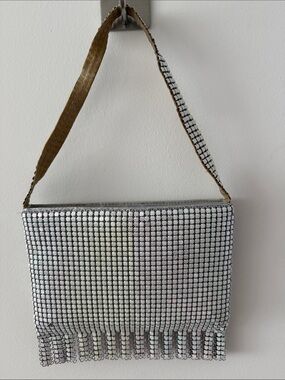 Marlo White Iridescent Mesh Bag With Top Strap & Fringe Along the Bottom.